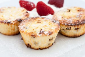 Cottage cheese syrniki, baked as cupcakes or muffins, served with yogurt and strawberries