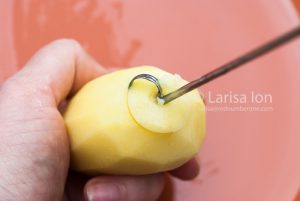 Steps of preparing raw potatoes for a stuffing close up.