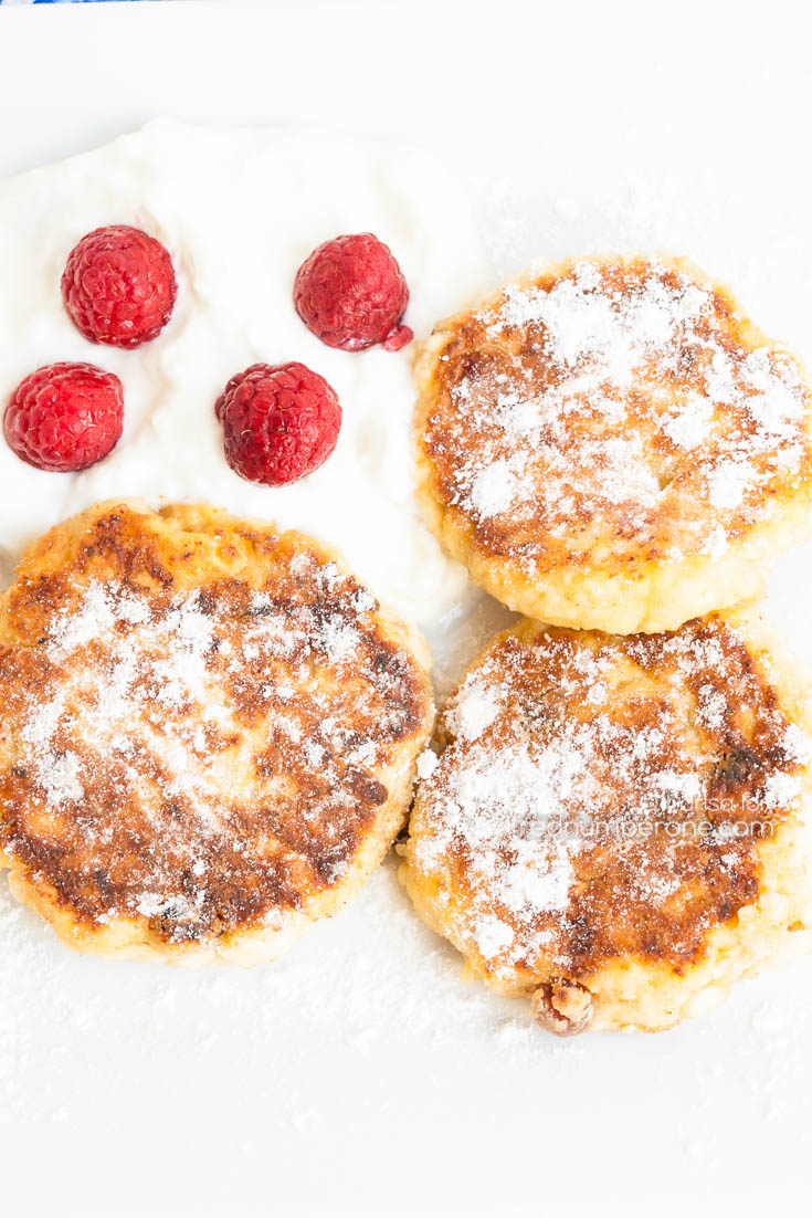 Syrniki (Russian and Ukrainian pancakes) served with sour cream